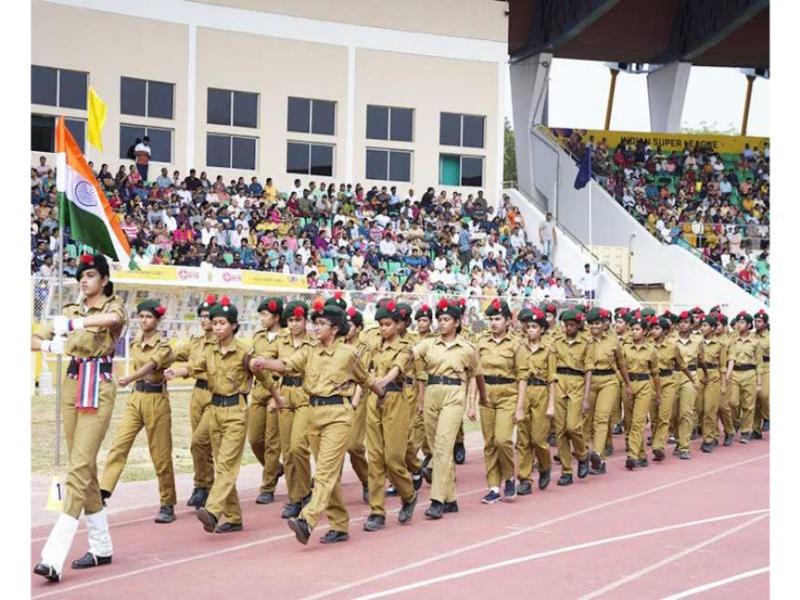 Brahmachari Dr. Girish Chandra Varma Ji, the Honourable Chairman of Maharishi Group of Institutions, graced the Silver Jubilee Celebrations of Maharishi Vidya Mandir, Kondapur, Hyderabad, on December 7, 2024, at the GMC Balayogi Athletic Stadium, Gachibowli, Hyderabad. The event also marked the school’s Annual Sports & Cultural Day, with more than 3000 students from Nursery to Class XII participating in various cultural and sports activities.
The program began with the lighting of the ceremonial lamp by Brahmachari Dr. Girish Ji, along with the school’s Principal, Mrs. Vasanthy Parasuraman, and Directors of Maharishi Vidya Mandir Schools Group, followed by Guru Pujan. Brahmachari Dr. Girish Ji then hoisted the sports flag, marking the commencement of the day’s events, which included a march past by the students led by the school’s NCC cadets.
The Principal, Mrs. Vasanthy Parasuraman, delivered the welcome address, highlighting the growth and achievements of Maharishi Vidya Mandir, Hyderabad, over the past 25 years and its reputation for quality education and discipline. This was followed by an address by Brahmachari Dr. Girish Ji, who congratulated the school on its milestone and praised the efforts of the students, staff, and parents in maintaining its excellence.
The event was attended by over 8000 parents and guests, who witnessed the celebrations and performances, making the occasion memorable and grand.
